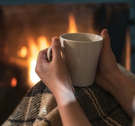 Sitting by the first with a warm drink