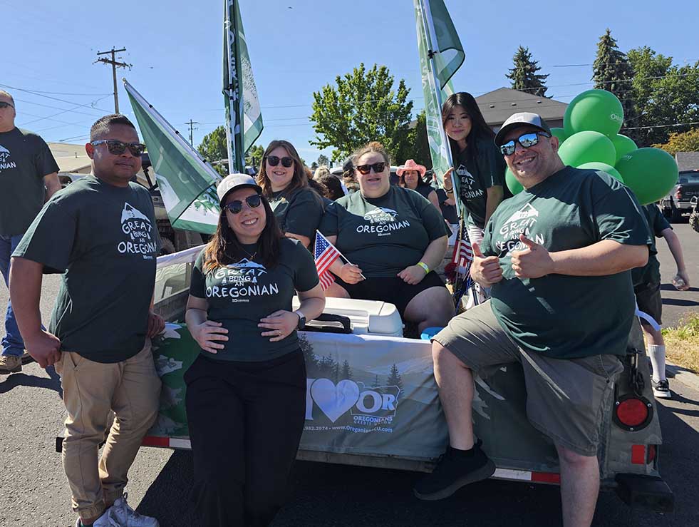 Group of Oregonians standing at a trailer lining up for a parade
